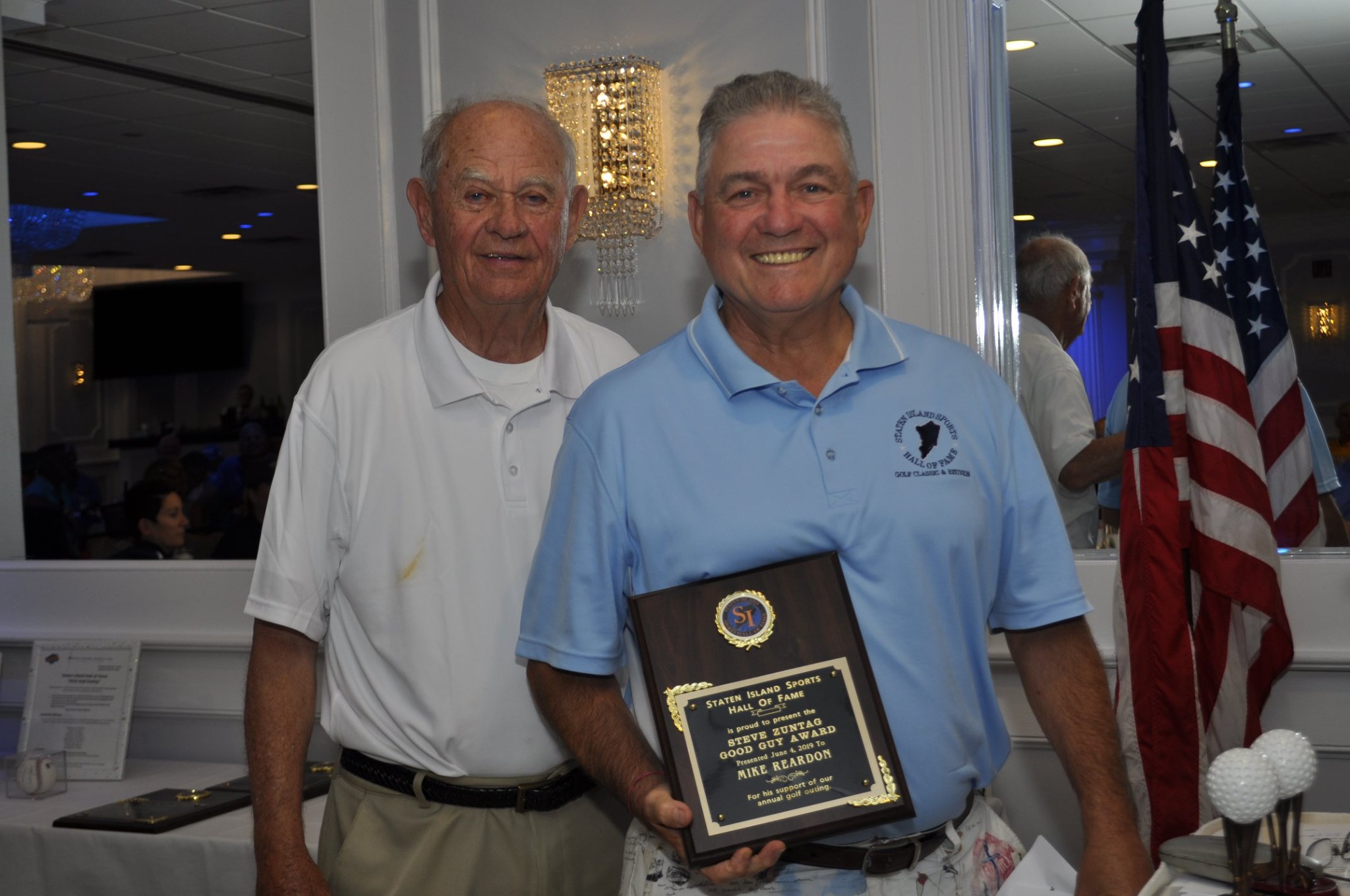 Golf chairman John Woodman Sr. (left) with Mike Reardon (right), a Steve Zuntag Good Guy Award winner.