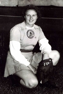 Gloria Cordes Elliott full body shot of her on one knee in uniform with glove