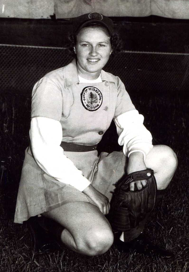 Gloria Cordes Elliott full body shot of her on one knee in uniform with glove