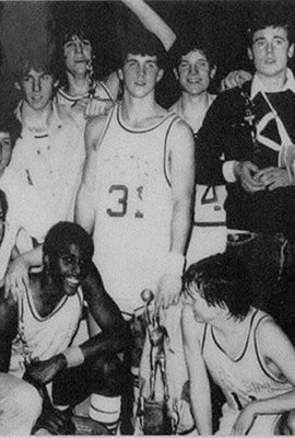 The 1983 St. Peter's High School Basketball Team celebrating their victory winning the city championship.