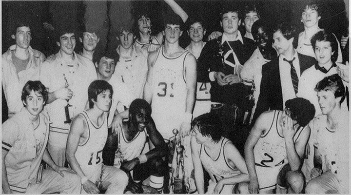 The 1983 St. Peter's High School Basketball Team celebrating their victory winning the city championship.