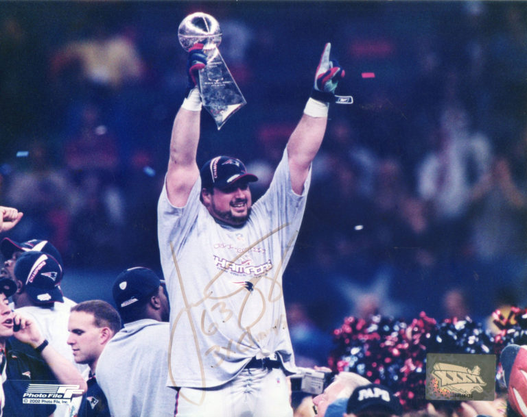 Joe Andruzzi triumphantly holding Lombardi trophy over his head